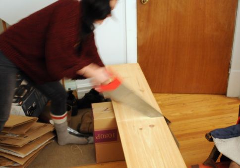 Laura sawing her first shelf